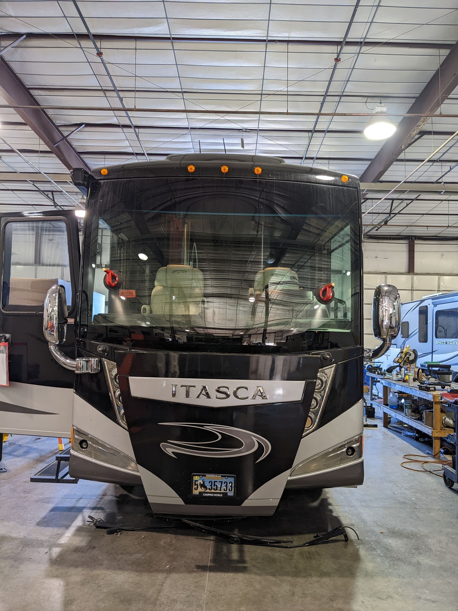 Itasca Class A motorhome in the shop for windshield replacement