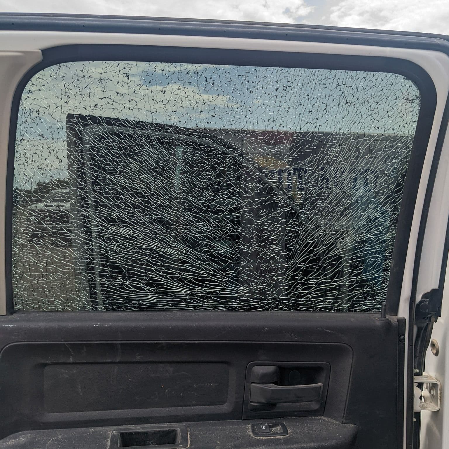 Shattered tempered side window on a pickup truck