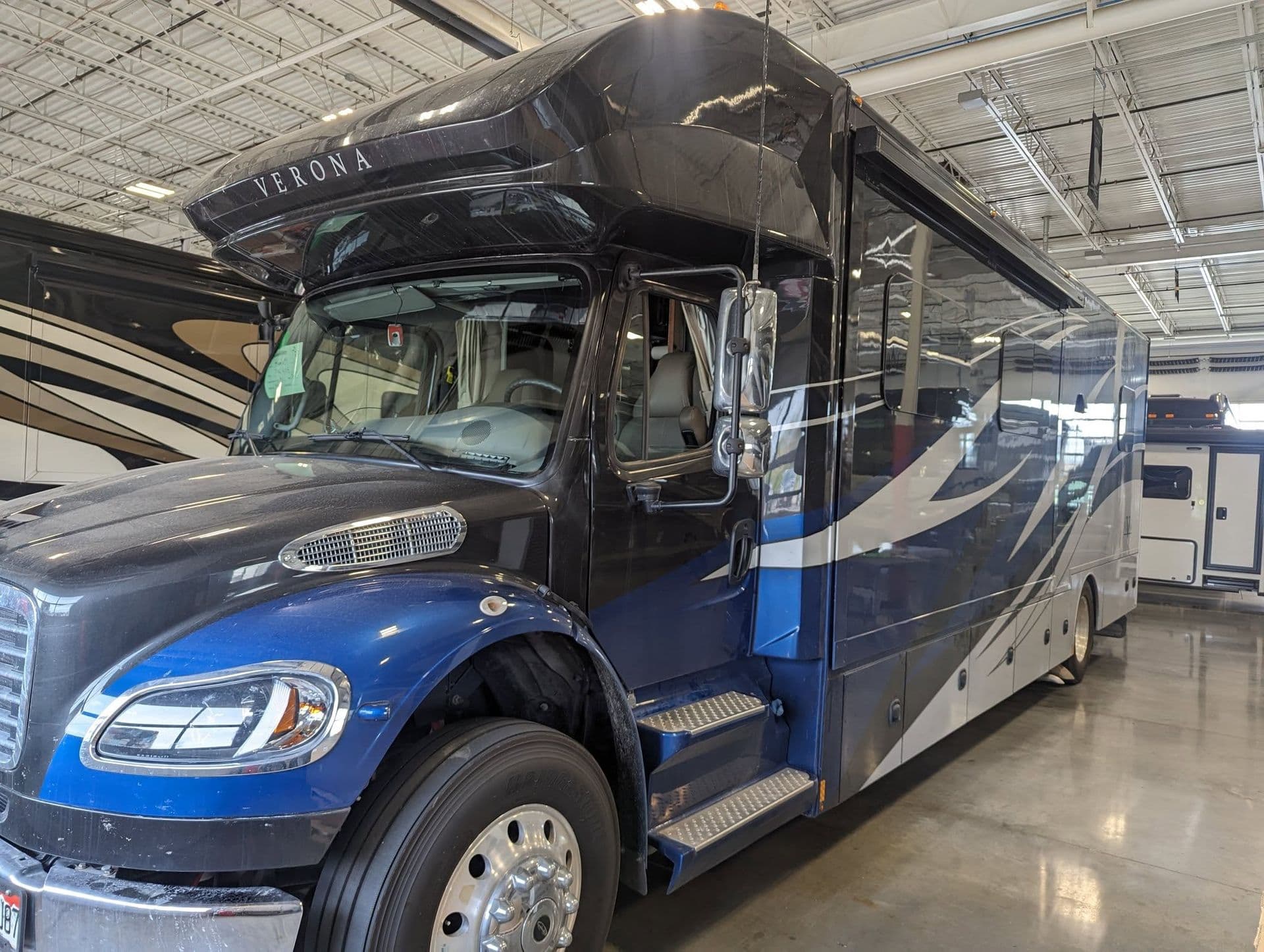 Super C motorhome on a Freightliner chassis in the service bay