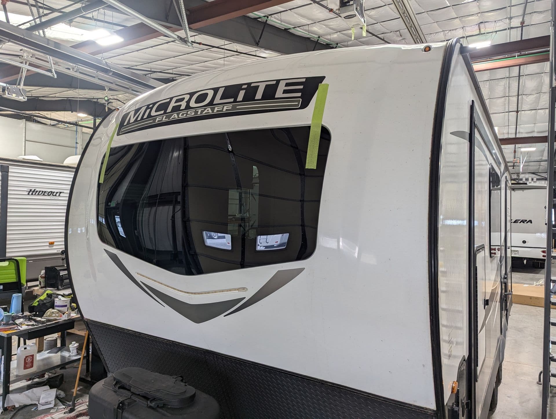 Flagstaff Microlite travel trailer front window taped after installation